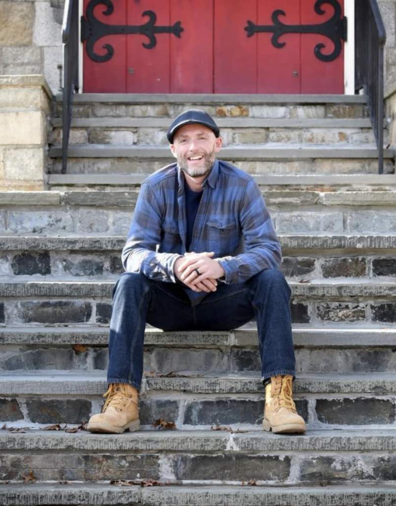 a man sitting on steps