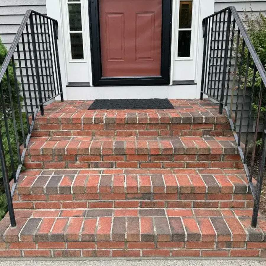 a brick stairs leading to a door