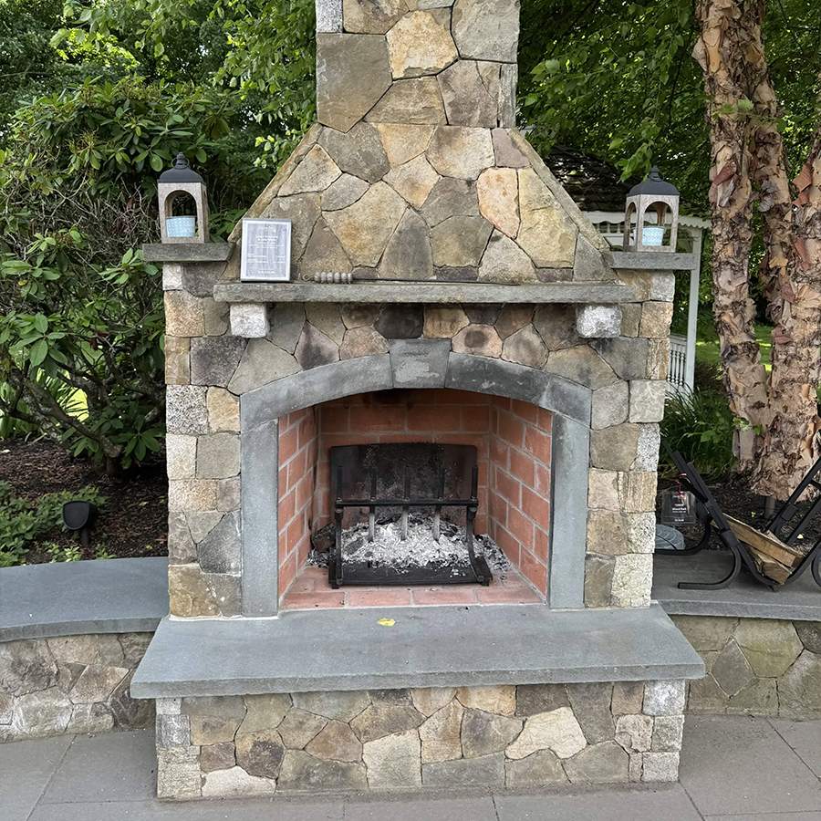 a stone fireplace with a chimney