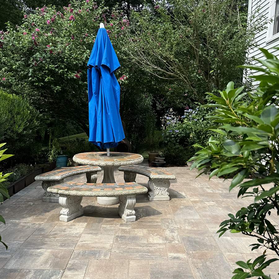 a table and umbrella on a patio